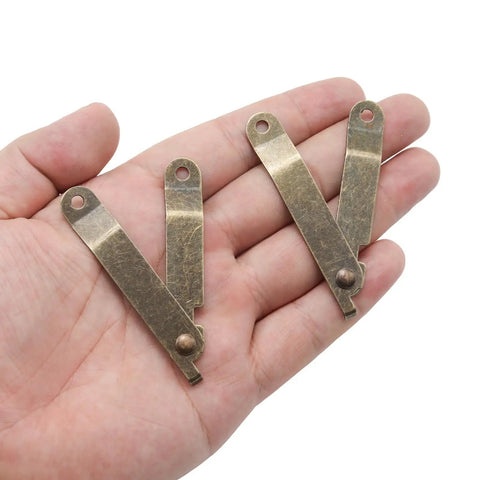 4 Pack Small Antique Brass Folding Lid Support Hinges for Wooden Boxes Jewelry Cases and Chests, held in hand for scale.