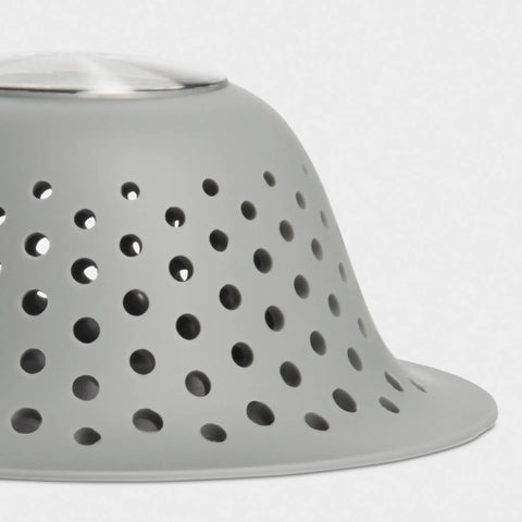Silicone Shower And Tub Drain Protector Hair Debris Catcher With Tall Domed Design shows close-up of grey perforated surface.