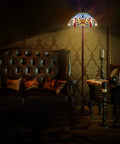 Blue Tiffany Style Floor Lamp 64 Inch Tall with Stained Glass Shade beside leather sofa in dimly lit room