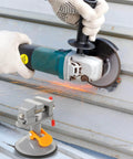 Multi Functional Rotating Bench Vise With Swivel Tabletop Clamp for woodworking and DIY projects shown with angle grinder in use