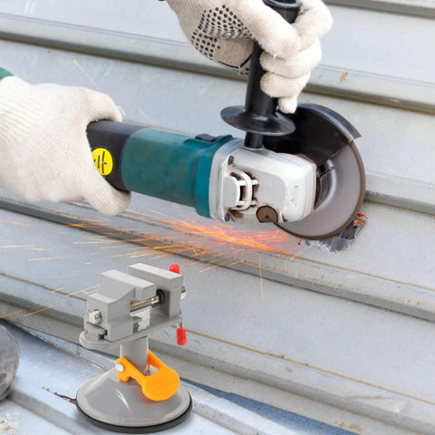 Multi Functional Rotating Bench Vise With Swivel Tabletop Clamp for woodworking and DIY projects shown with angle grinder in use