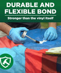 Applying industrial grade heavy duty vinyl adhesive for PVC and vinyl repairs that bonds under water stays flexible after cure.