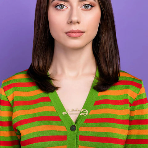 Must Have Set Of Twenty Super Tough Golden Loop Safety Pins To Quick Fix Denim And Anchor Heavy Skirts While Halting Embarrassing Wardrobe Malfunctions Daily on a colorful striped cardigan.