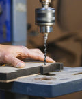 Twelve Inch Wood Auger Drill Bit With One Half Inch Diameter And Three Eighths Inch Hex Shank in drill press working on wood