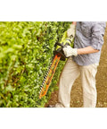Person using 22 Inch Cordless Hedge Trimmer With 18 Volt Power Delivers Beast Mode Performance In A Lightweight Easy To Maneuver Package For Home Yards And Precise Hedge Pruning on hedge.