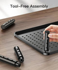 Close-up of the Dual Monitor Desk Stand With Height Adjustable Riser Laptop And Monitor Stand components being assembled without tools.