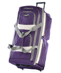 Olympia U.S.A. 29-inch purple wheeled duffel bag with gray straps and retractable handle.