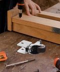 Rugged Swivel Furniture Casters With Gliding Silent Rollers And Tough Round Plates Built For Cabinets Drawers And Office Gear On Hardwood Floors Featuring Quick Fit Brake Clamps For Any Space, shown during installation.