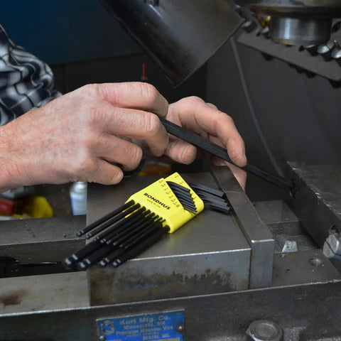 Person using Ball End L-Wrench Set Of 13 Balldriver Tools With Sizes From.050 To Three Eighths Inch on machinery