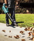 Person using 18V LXT Brushless Cordless Blower With Cruise Control, Variable Speed Trigger, And Speed Lock For Continuous Operation