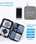 2 Pack Travel Laundry Bags With Handles And Aluminum Carabiner Dirty Clothes Organizer in suitcase next to smartphone