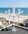 Vertical Wind Turbine Generator Kit 12V 3-Phase Permanent Magnet Generator 3 Blade on rooftop near ocean view