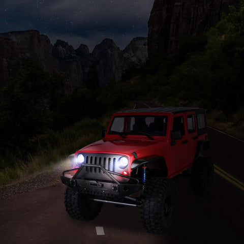 RC crawler with 8 LED RC Light Kit featuring 4 white and 4 red lights, Traxxas Slash setup, on nighttime trail, receiver-powered.