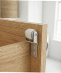 Close-up of Smooth As Butter Sliding Door Roller Track Guide Wheels 6 Pack, nylon wheel attached to wooden door.