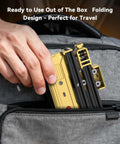 Front view of Artilume T1 foldable laser engraver, yellow portable handheld device being placed into a backpack