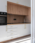 White kitchen cabinets with Solid Brass Kitchen Cabinet Pulls Set of 6 in Polished Gold with Hammered T-Bar Handles