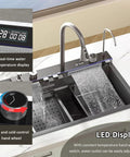Smart Kitchen Sink with Digital Display, Dual Waterfall Design, Pull-Out Faucet, Pressurized Cup Washer for Modern Kitchens showing LED display and water control.