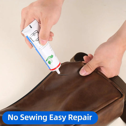 Hands applying Heavy Duty Leather Glue For Permanent Clear Bonding Of Leather Goods Like Sofas Car Seats Purses Boots And More Waterproof Adhesive That Actually Sticks Like A Champ On Cowhide Suede Canvas And Rubber 2 Oz to a brown leather bag