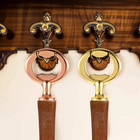 Front view of two metal wall-mounted bottle openers with circular rings in rose gold and gold finishes, wooden handles.