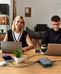 Office setup with laptops connected to GaN PD 450W 10 Ports USB C And USB A Charger Hub With 5 Type C And 5 USB A Ports on a desk.