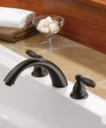 Claymore Two-Handle Widespread Roman Tub Faucet Trim Kit In Oil-Rubbed Bronze PTT298696-OB, installed on bathroom tub ledge.