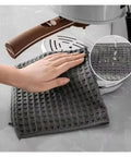 Hand using Barista Cleaning Cloth Set For Coffee Machines And Espresso Equipment Non Shedding Absorbent Towels 5 Pack