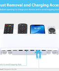 No Drill Remote Holder For 5 Or 6 Remotes, Easy Adhesive Wall Mount, Tool Free Installation, Premium White Remote Control Organizer with dust removal vents, showing four held remotes and a charging phone.