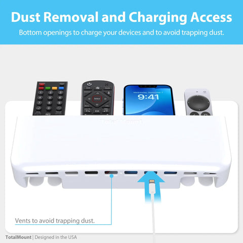 No Drill Remote Holder For 5 Or 6 Remotes, Easy Adhesive Wall Mount, Tool Free Installation, Premium White Remote Control Organizer with dust removal vents, showing four held remotes and a charging phone.