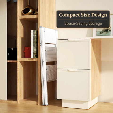 Lightweight Aluminum 3 Step Folding Step Stool With Wide Anti Slip Pedals, 330 Lbs Capacity, stored flat beside a cabinet