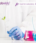 Person using lab equipment with colorful liquids in flasks for laboratory testing.
