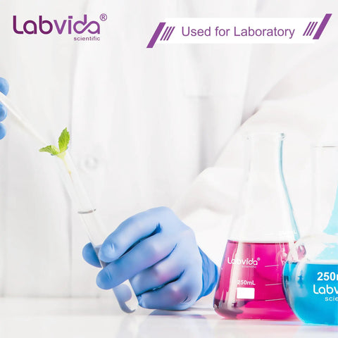 Person using lab equipment with colorful liquids in flasks for laboratory testing.