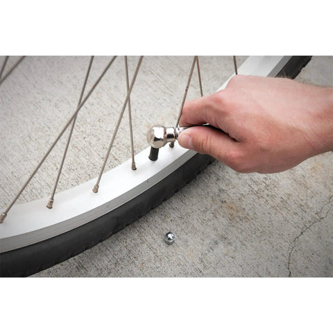 Person using Four Ft Rugged Pvc Air Hose With Snap On Tire Chuck Rated At Three Hundred Psi For Everyday Yard Work And Garage Hacks Kink Resistant Grip Safe Ultra Flex Line to inflate bicycle tire.