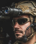 Heavy Hit Ballistic Safety Sunglasses Featuring Milspec Impact Resistant Wrap Frame And Ansi Certification on a soldier in tactical gear.