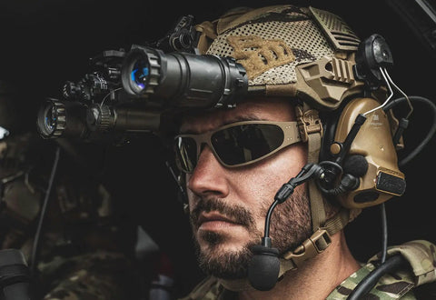 Heavy Hit Ballistic Safety Sunglasses Featuring Milspec Impact Resistant Wrap Frame And Ansi Certification on a soldier in tactical gear.