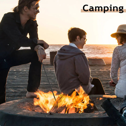 Person using 32 Inch Heavy Duty Campfire Poker With Wooden Handle For Fire Pit Outdoors Or Indoors Camping Fireplace Bonfires Rust Resistant Portable