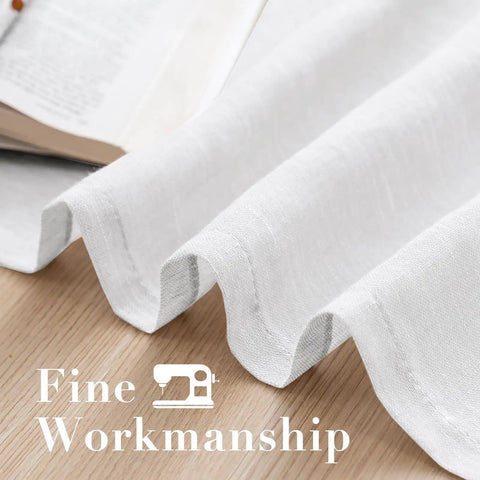 Close-up of white linen sheer curtains showing fine workmanship with grommet panels, part of the set for living room farmhouse style.