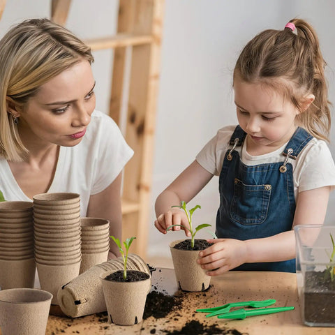 Child planting in 130 Pcs Biodegradable 3 Inch Peat Pots Seed Starting Kit With Drainage Holes Round Plant Seedling Pots Garden Germination