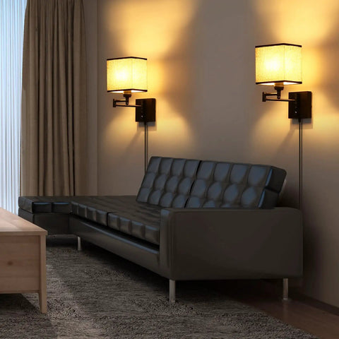 Set Of 2 Plug In Wall Lamps With Swing Arm Sconces, dimmable corded lights, no hardwire needed, black fabric shade illuminating a living room