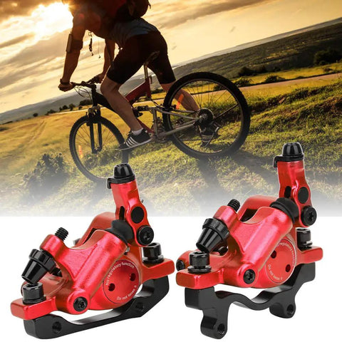 Rock Solid Top Tier Hydraulic Disc Brake Set Featuring Two Way Paddle Levers And Sturdy Aluminum Alloy Calipers For Front Rear Mountain Bike Ebike Setup Ready To Roll In Bright Red Finish, shown on a mountain bike.