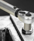 Close-up of a tool using the 27 Piece Screw Extractor Set With Hex Head And Multi Spline Easy Out Kit on a metal hex nut.