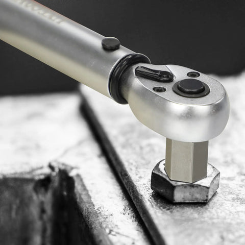 Close-up of a tool using the 27 Piece Screw Extractor Set With Hex Head And Multi Spline Easy Out Kit on a metal hex nut.