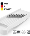 Angled side view of white Börner Wave-Waffle XXL PowerLine crinkle-cut vegetable slicer with stainless-steel blades