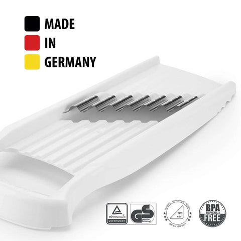 Angled side view of white Börner Wave-Waffle XXL PowerLine crinkle-cut vegetable slicer with stainless-steel blades
