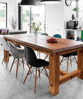 Wooden table with chairs in a modern kitchen, showing the use of Heavy Duty Cross Dowel And Bolt Kit Eight Pack For Bed Frames And Workbenches