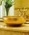 USZWBY Bathroom Vessel Sink, Countertop Basin Round Sink with a gold finish on a marble countertop.