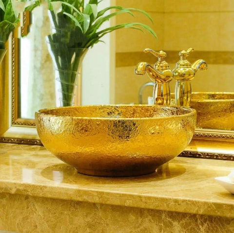 USZWBY Bathroom Vessel Sink, Countertop Basin Round Sink with a gold finish on a marble countertop.