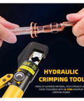 Heavy Duty Hydraulic Crimping Pliers Tool For Electric Terminals And Cable Lug Kit featuring a hand gripping the tool and terminal connection.