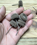 Hand holding 48 Piece Rotary Tool Buffing Wheel Set With Three Thirty Second Inch Mandrels And 2.35 Mm Shanks, shown up close.