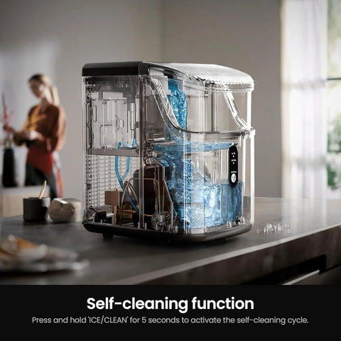 Kismile nugget ice maker countertop, portable silver unit with transparent housing and front control panel.