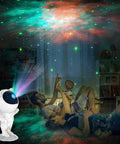 Astronaut Space Buddy Galaxy Projector Night Light with Remote 360 Degree Adjustable Nebula Vibe Star Projection Lamp for Bedroom And Game Room Kid Friendly Colorful Stars Nebula Colors Room Decor projecting colorful stars in a bedroom where family enjoys together.